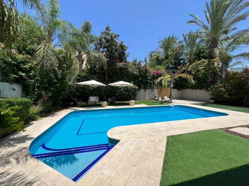 Elegant 5BR Haven with Sparkling Pool & Serene Garden Oasis