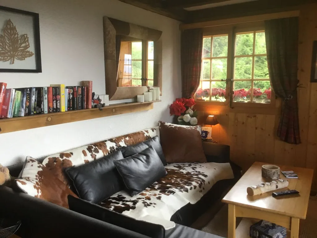 Typical Swiss Wooden Chalet Set In A Peaceful Location