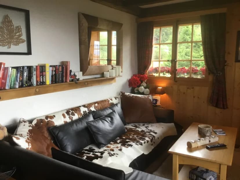 Typical Swiss Wooden Chalet Set In A Peaceful Location