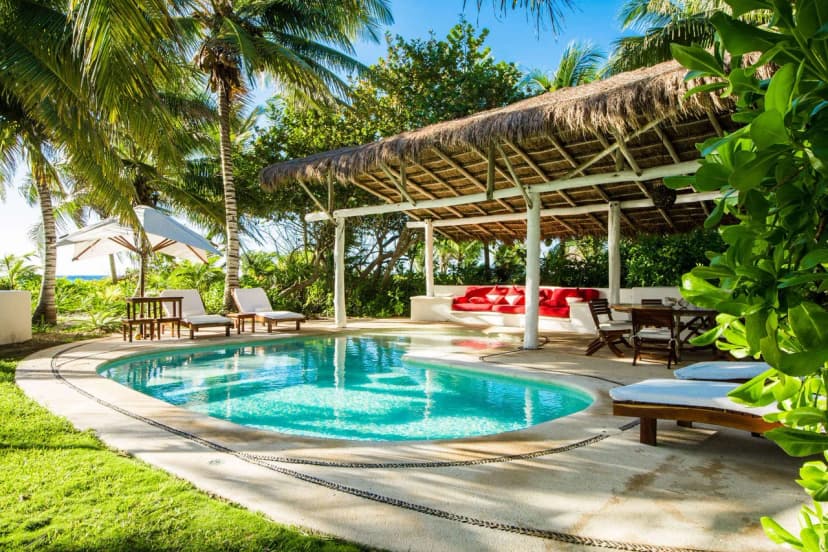 Beautiful Beach Villa With Palm Trees And Caribbean Sea