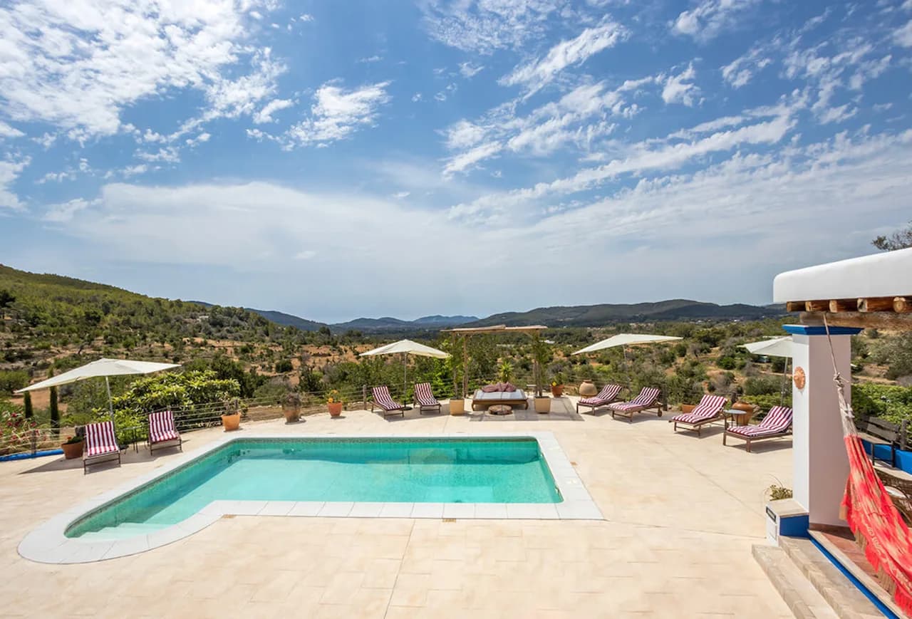 SITUATED ON A HILLSIDE JUST OUTSIDE THE VILLAGE OF SAN JUAN WITH SUNSET VIEWS OF BENIRRAS BAY