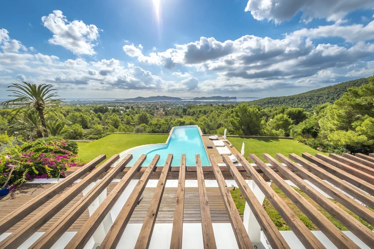 A Gaudi-influenced villa in lush gardens, with sea views to Las Salinas and Formentera