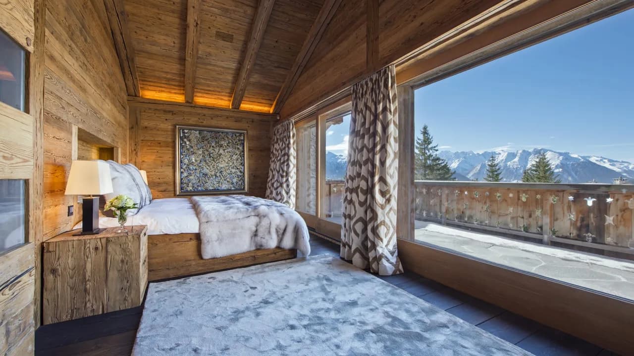 Contemporary chalet sits majestically on the banks of a pond photo 2