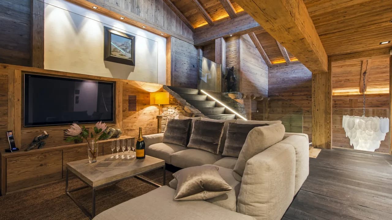 Contemporary chalet sits majestically on the banks of a pond photo 3
