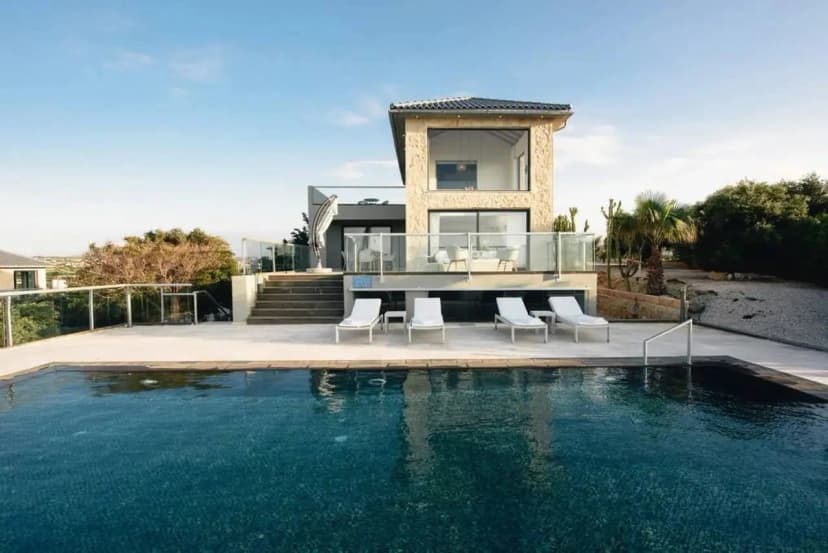 Exquisite Seafront Escape with Pool & Tennis Court
