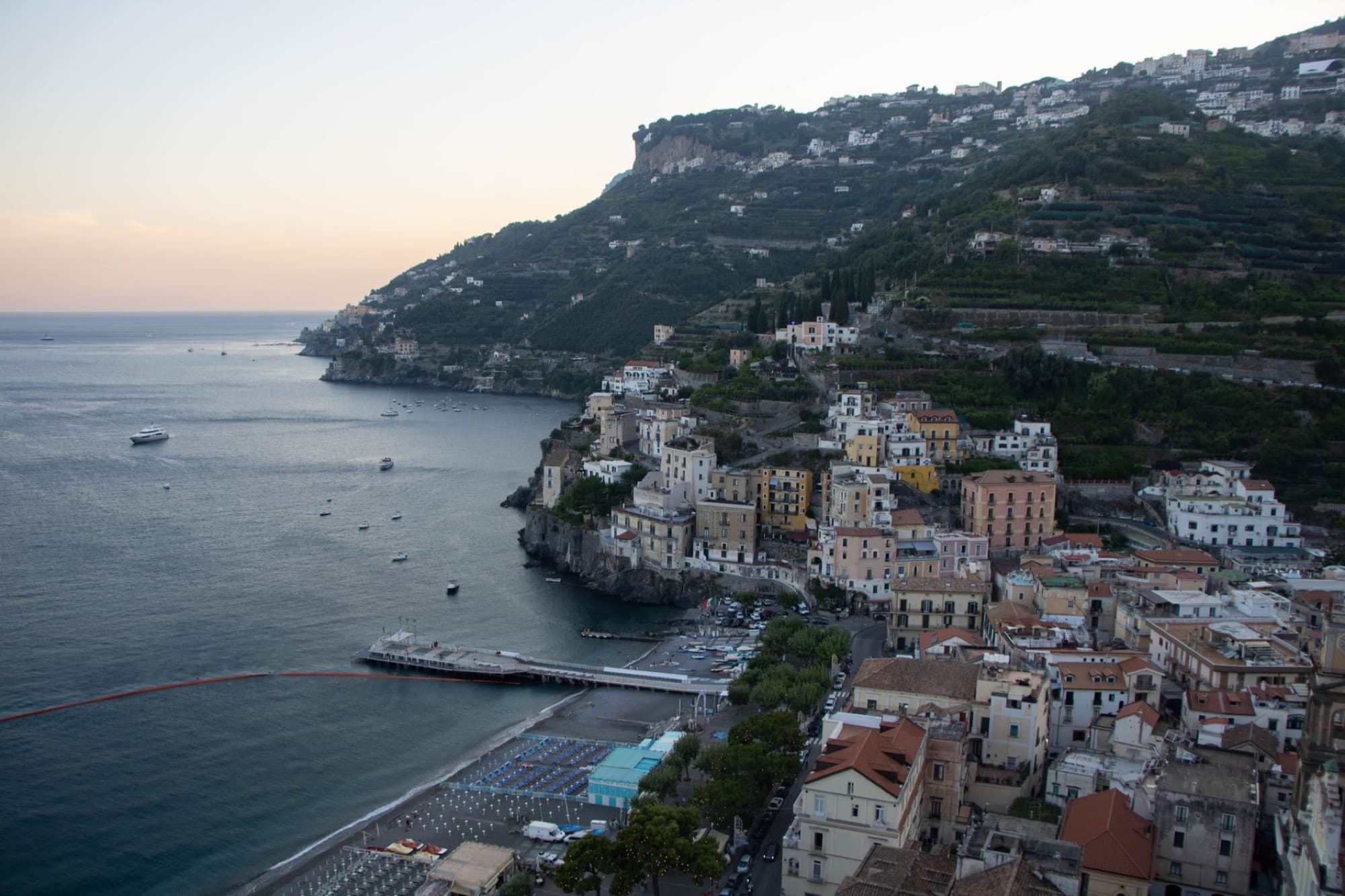 Capture of Minori's coastal town at sunset, showcasing scenic beauty of the Amalfi Coast, Campania, Italy.