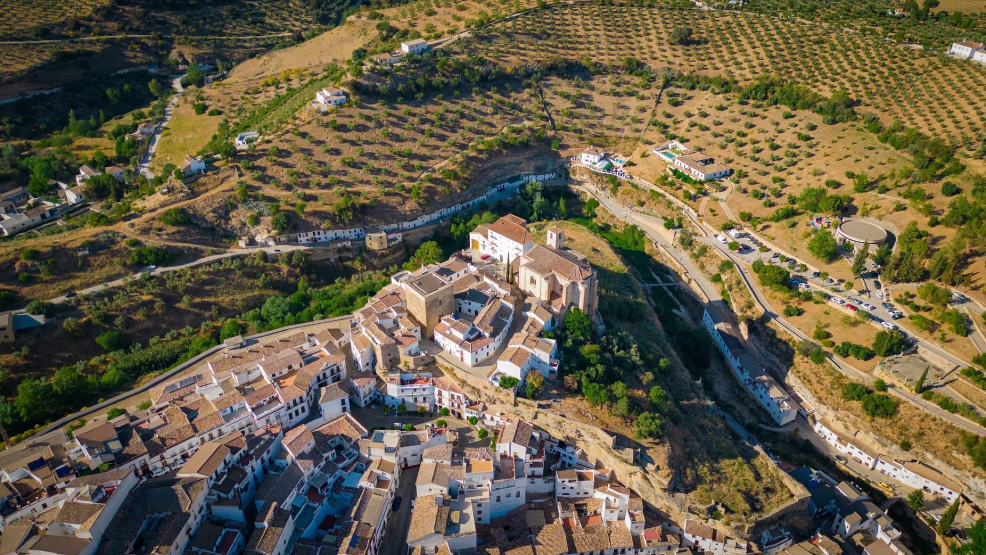 Cinematic aerial view of Setenil de las Bodegas showing unique town and landscape in Andalucía.
