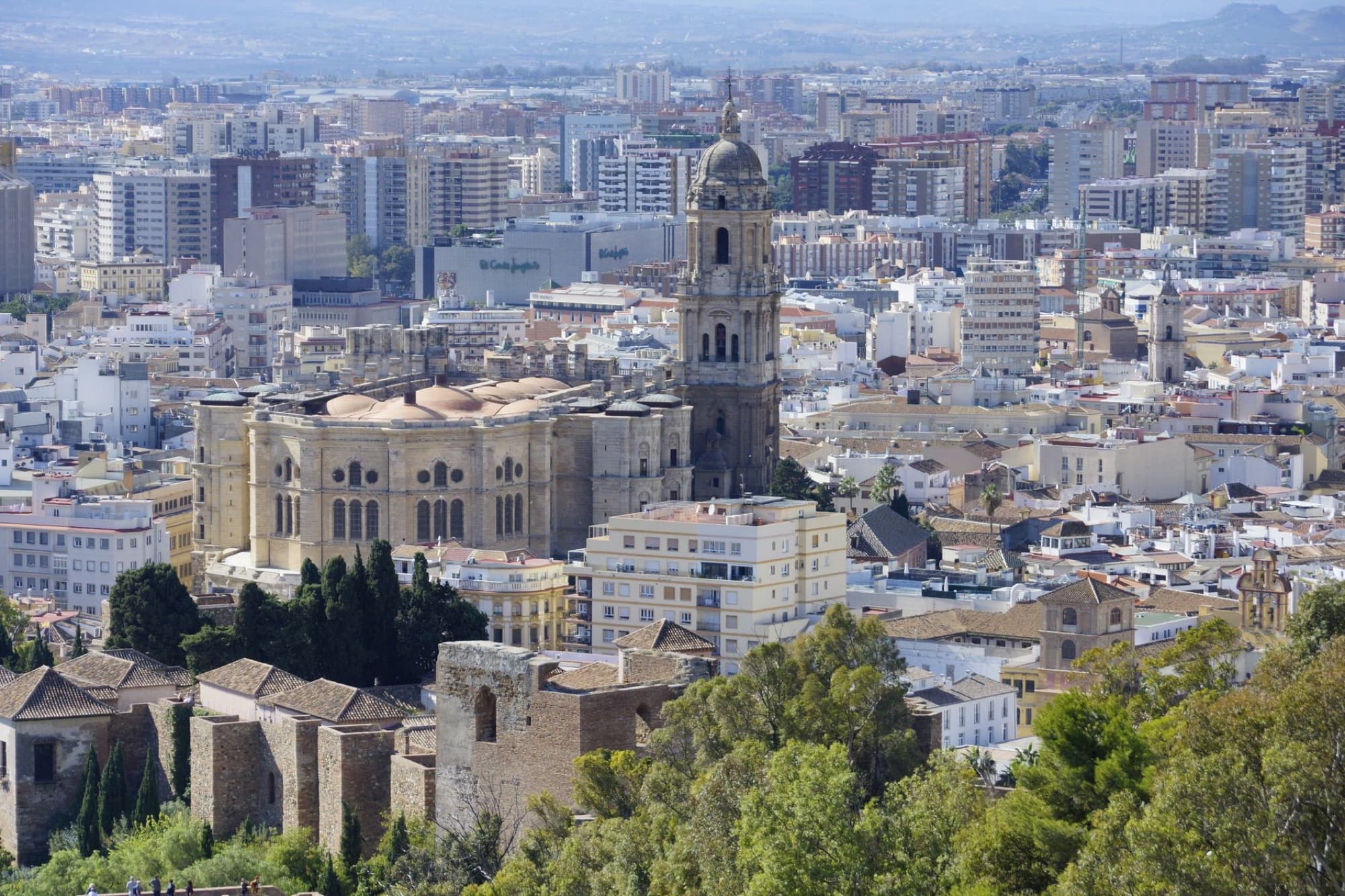 Aerial view capturing the historic Málaga Cathedral amidst the cityscape in Andalucía, Spain.