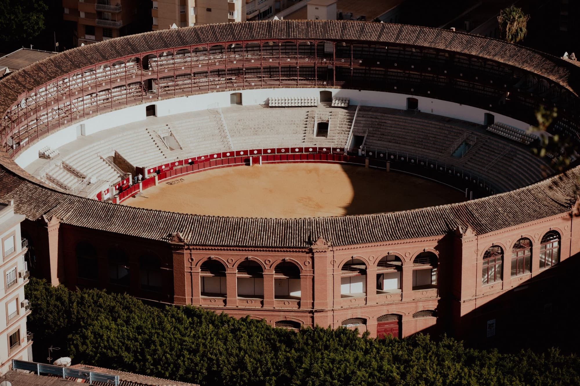Aerial view of the historic Málaga bullring in Andalucía, capturing its architectural beauty.