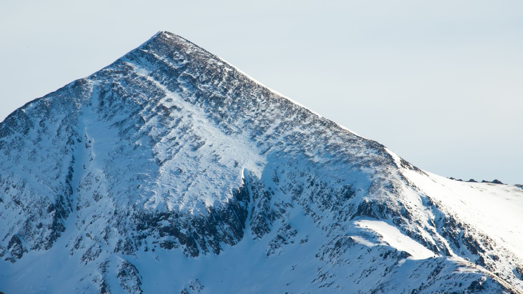 Stunning snow-covered peak capturing the serene beauty of Andorra's winter mountain scenery.