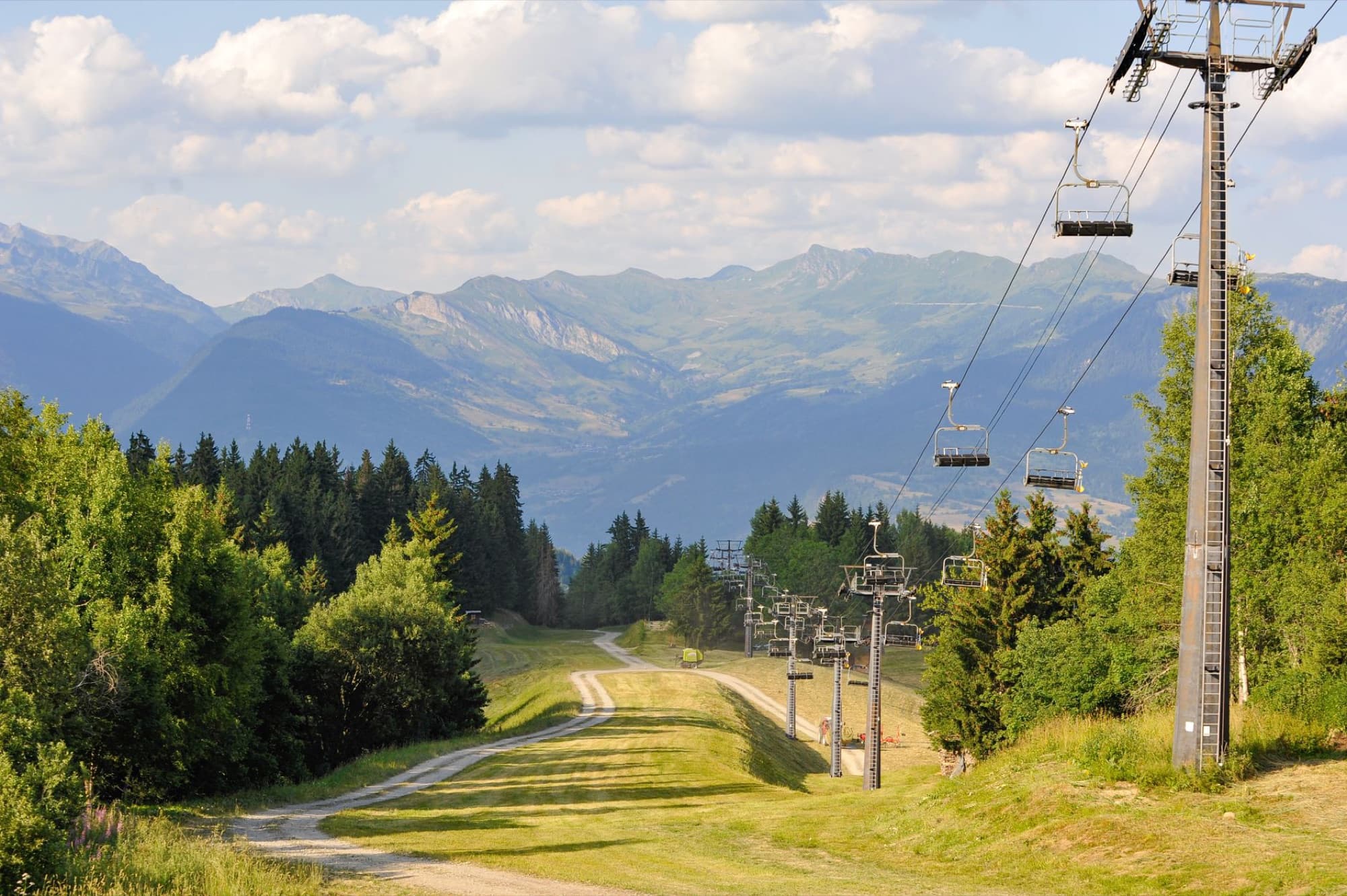 Peaceful landscape of the Alps in Auvergne-Rhône-Alpes, France with chairlift.