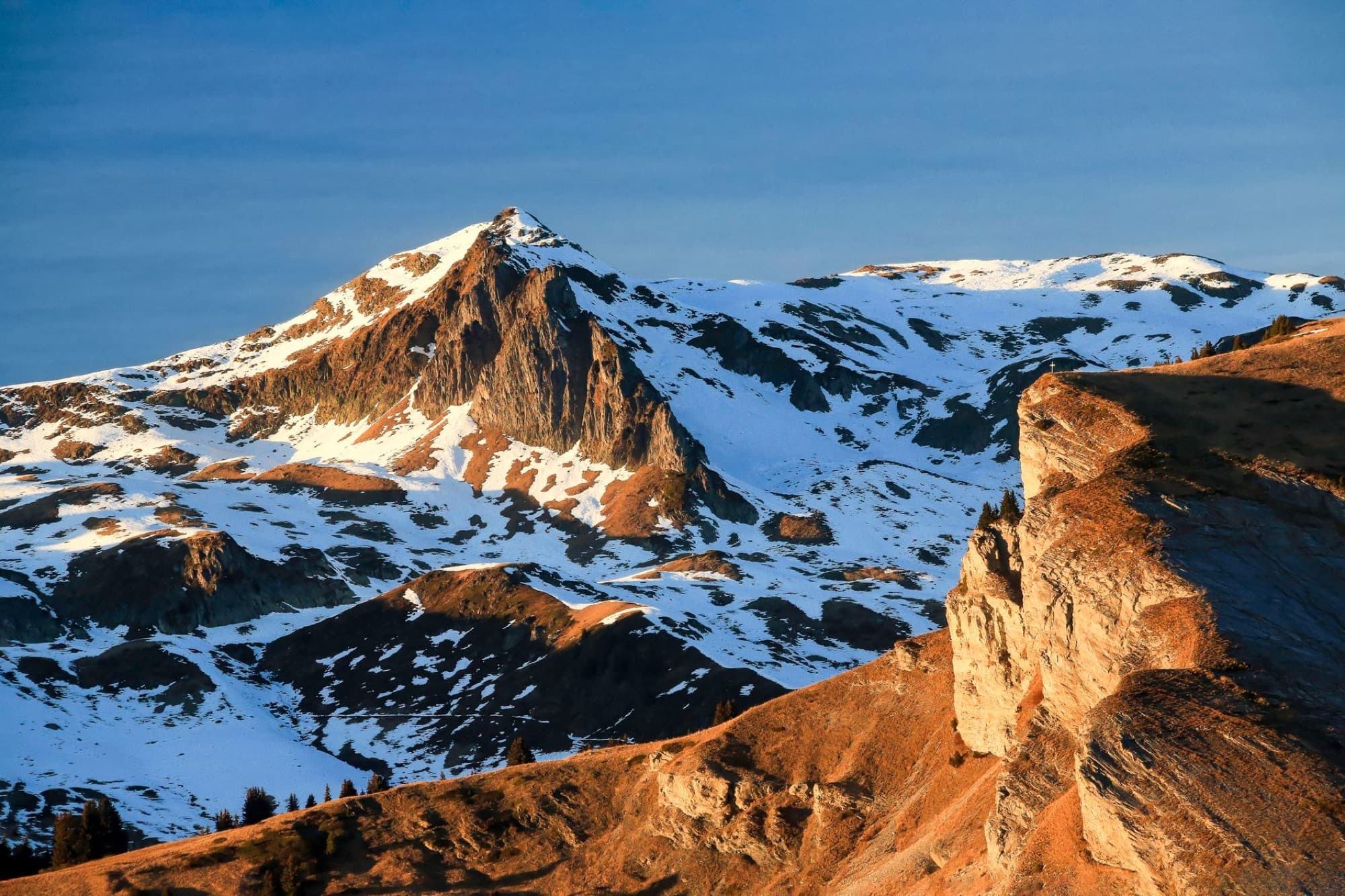 Scenic view of snow-capped mountains in Auvergne-Rhône-Alpes, France during sunset.