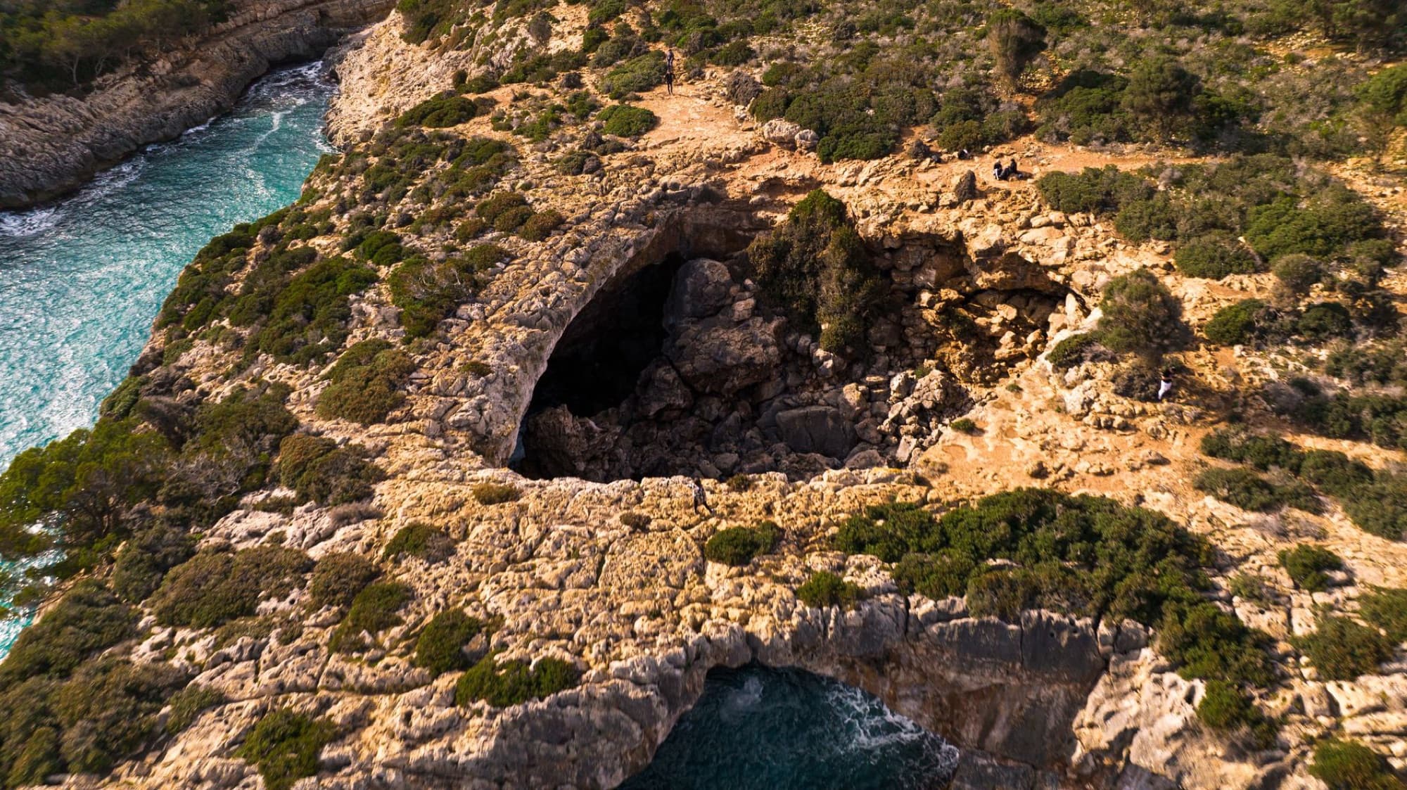Stunning aerial view of rocky cliffs and turquoise sea in Majorca, Balearic Islands, Spain.