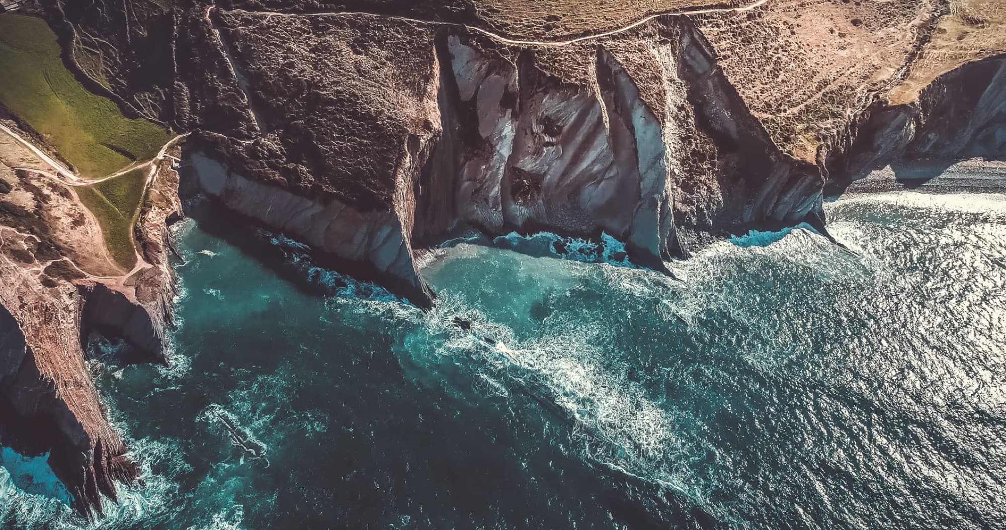 Scenic aerial view of Zumaya's dramatic cliffs and vibrant ocean waters.