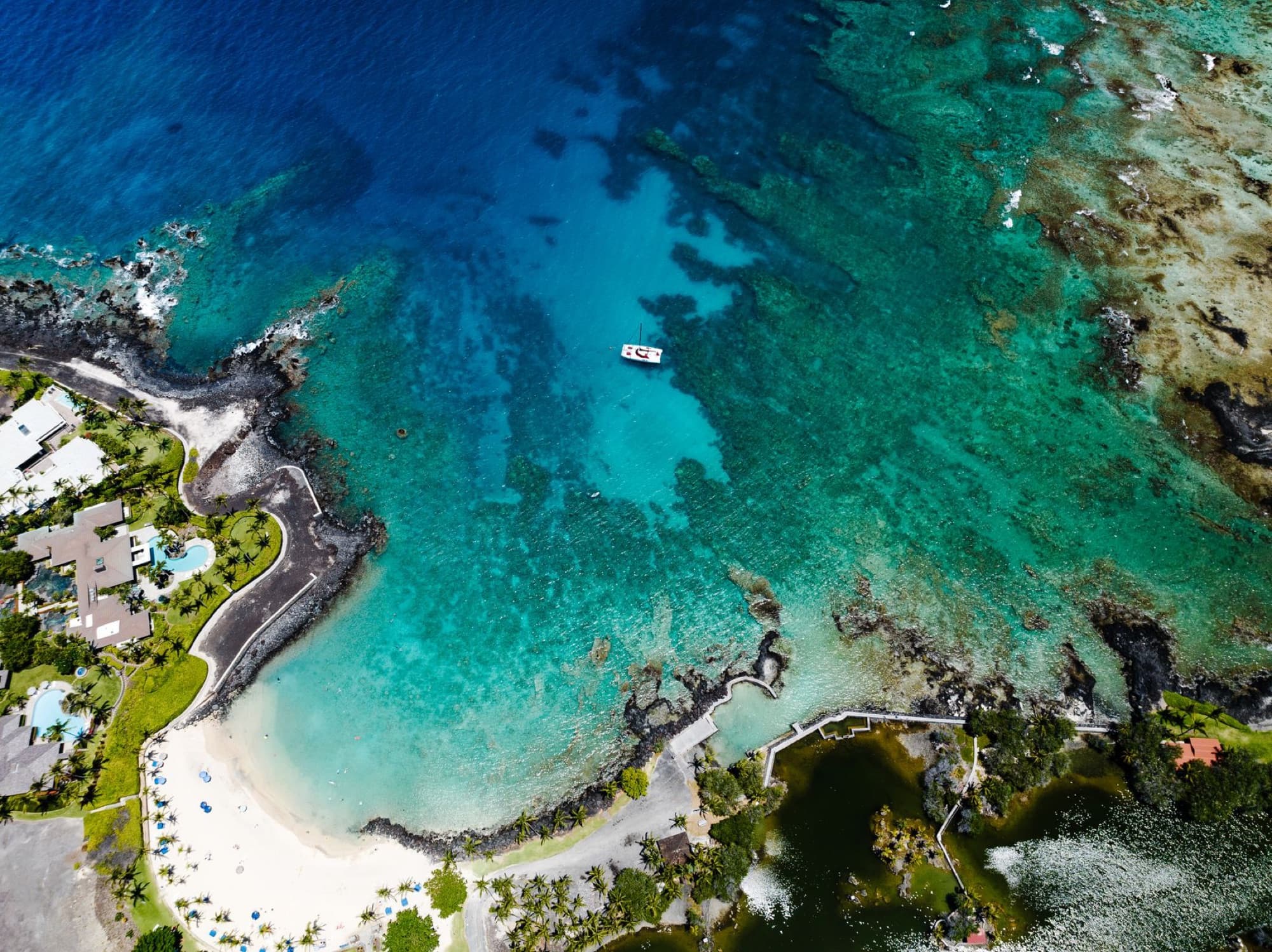 Stunning aerial view of Waimea's turquoise waters and scenic coastline in Hawaii.