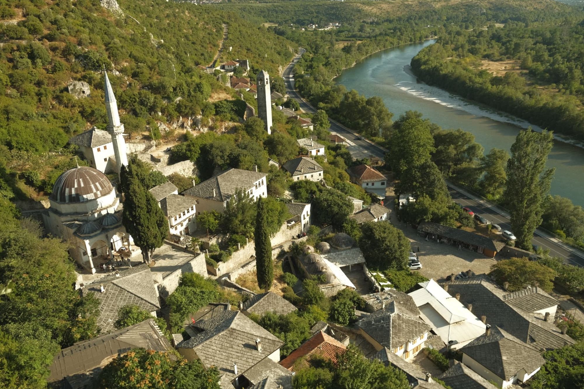 Stunning aerial shot of Počitelj village by the river in Bosnia and Herzegovina.