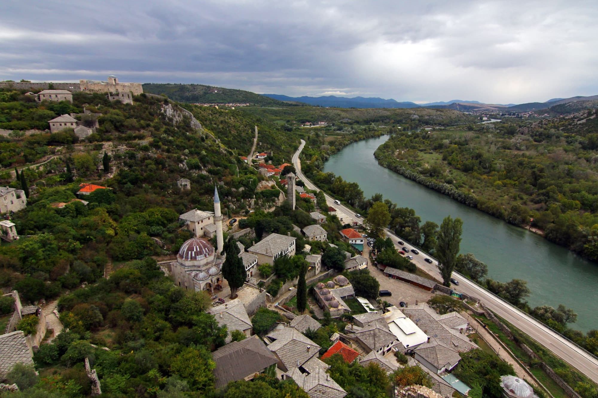 Discover the historic charm of Počitelj, a picturesque village by the river in Bosnia and Herzegovina.