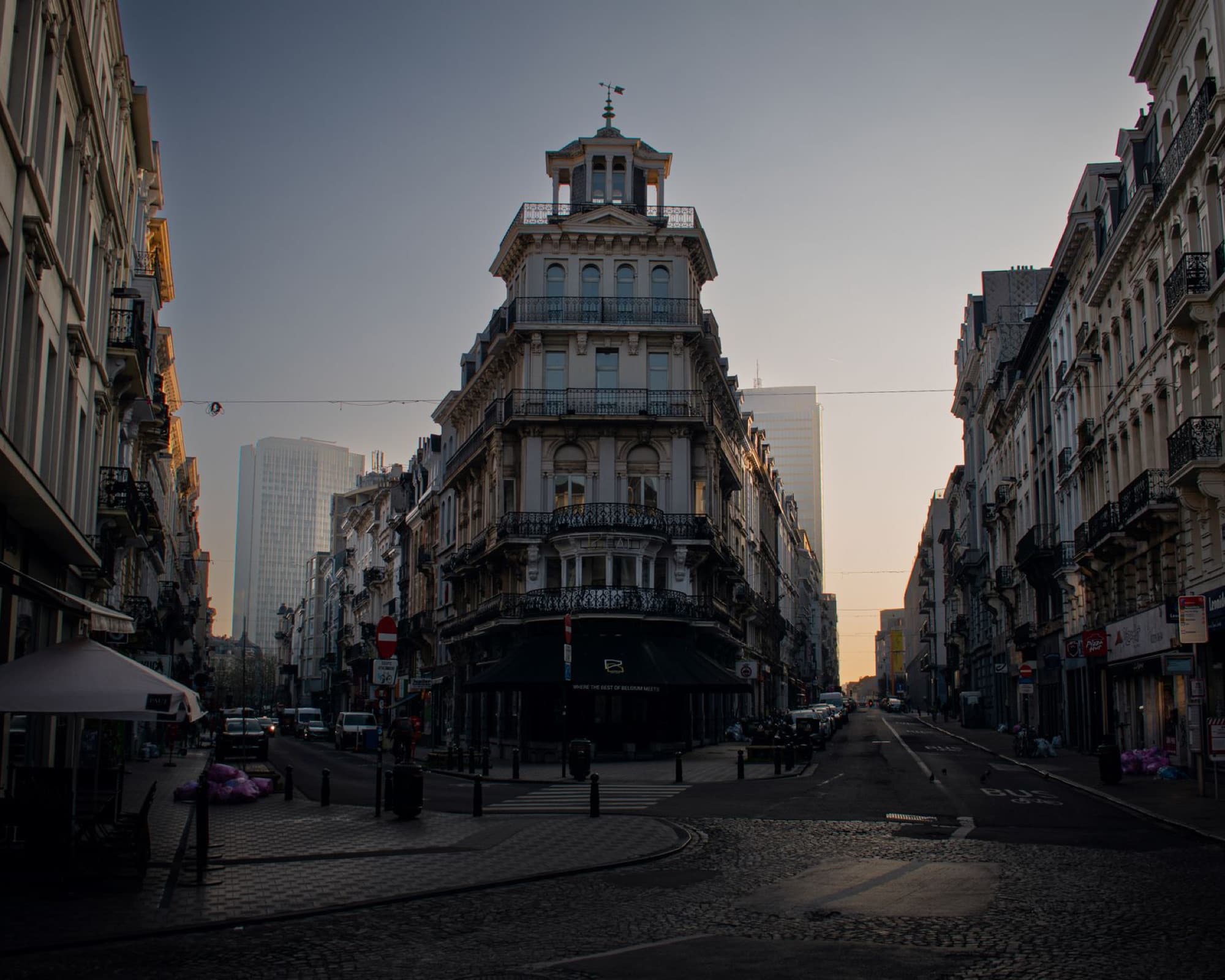 Classic European architecture in Brussels city at sunset, showcasing a mix of historic and modern buildings.