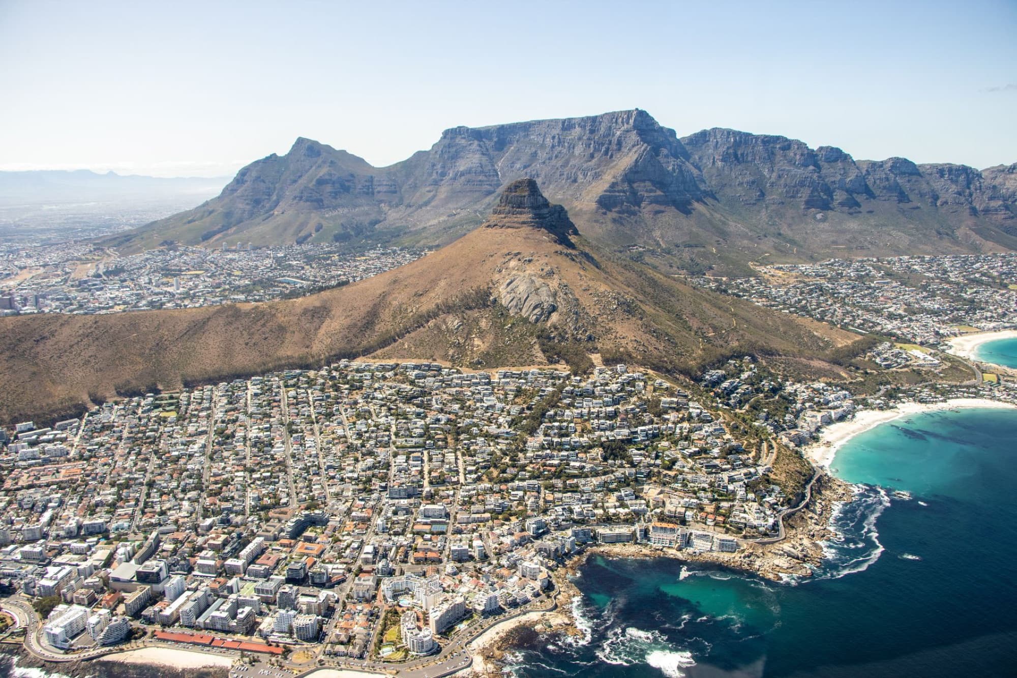 Breathtaking aerial view of Cape Town with Table Mountain and coastline.