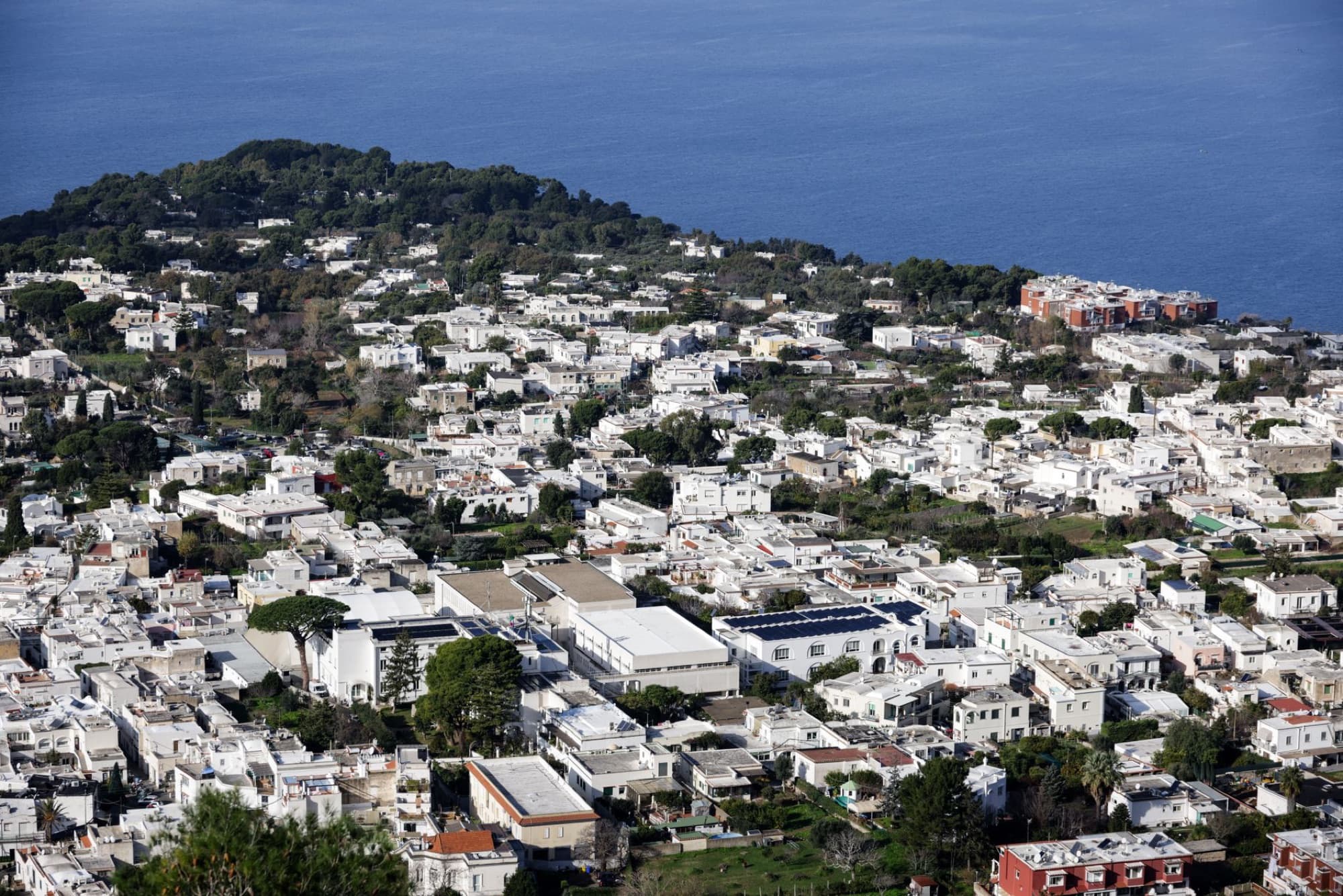 Stunning aerial view of Capri Island showcasing the Mediterranean coast and charming architecture.