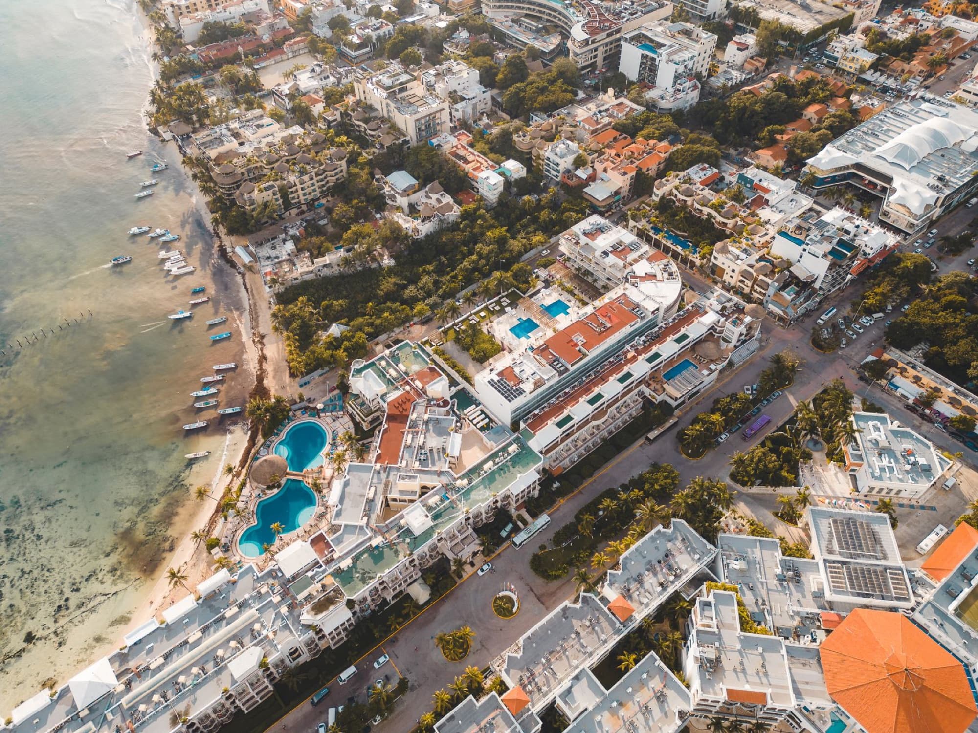 Stunning aerial shot of Playa del Carmen's urban landscape and beachfront in Mexico.