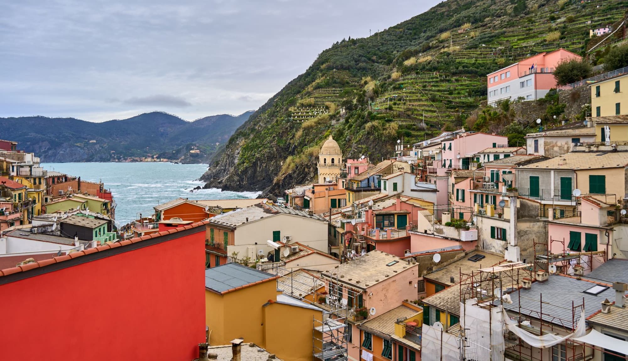 Aerial view of Vernazza, Cinque Terre with vibrant houses and scenic landscape.