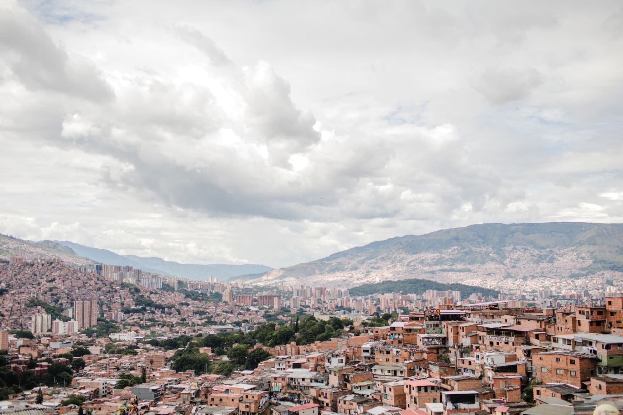 A stunning view of Medellín, Colombia, showcasing the city's urban landscape and surrounding mountains.