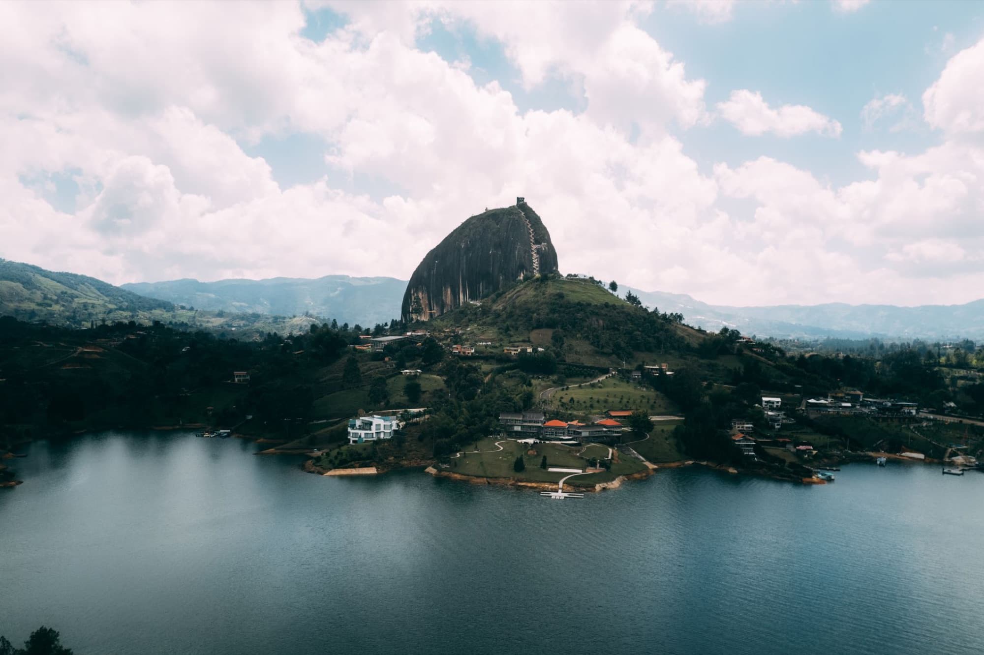 Stunning aerial view of the iconic El Peñol rock and surrounding landscape in Guatapé, Colombia.