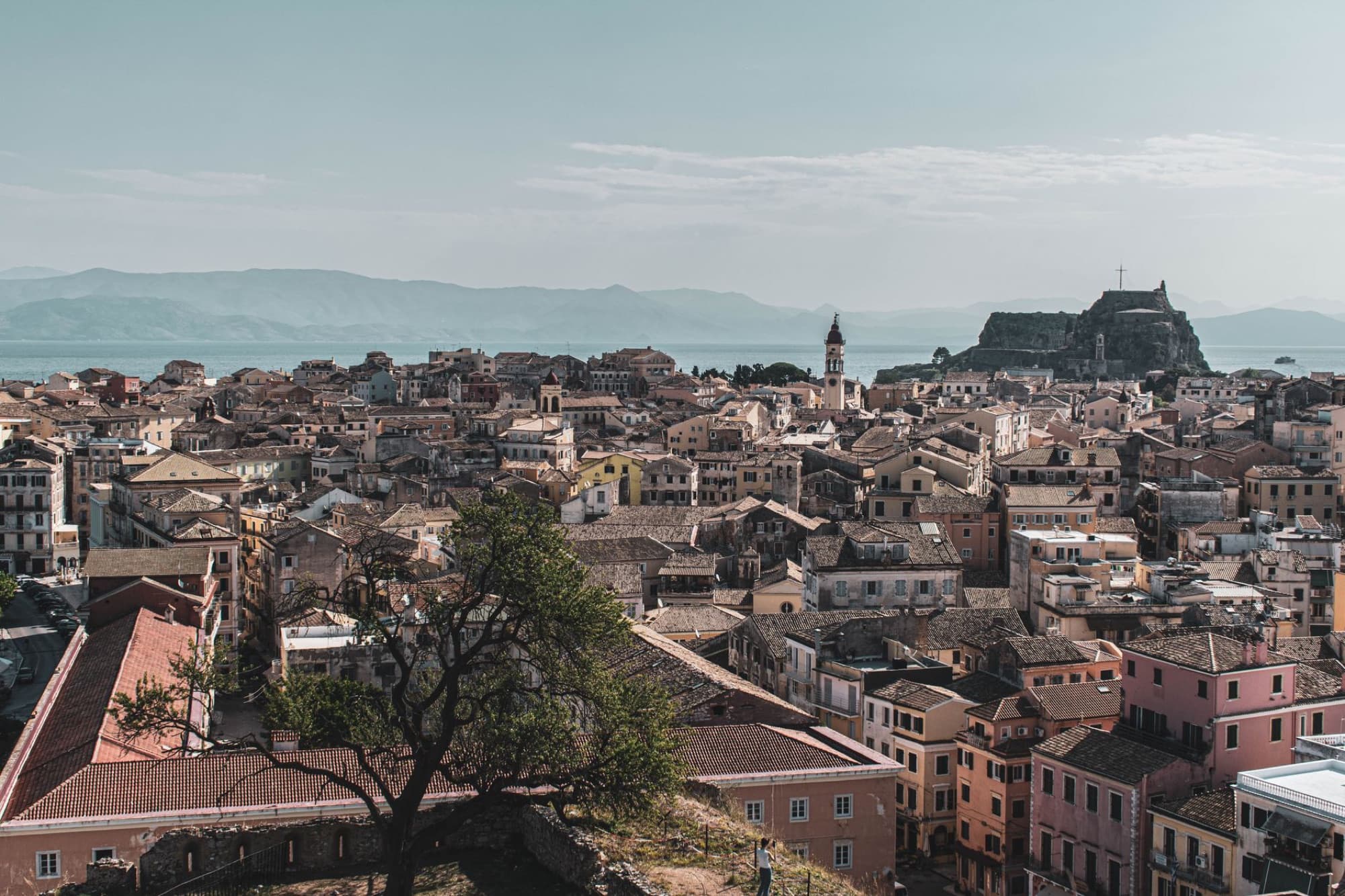 Scenic aerial view of Old Town Corfu with its distinctive fortress and Mediterranean architecture.