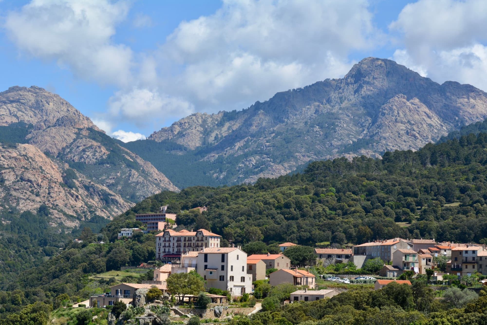 Beautiful view of Piana village nestled in Corsica's rugged mountains.