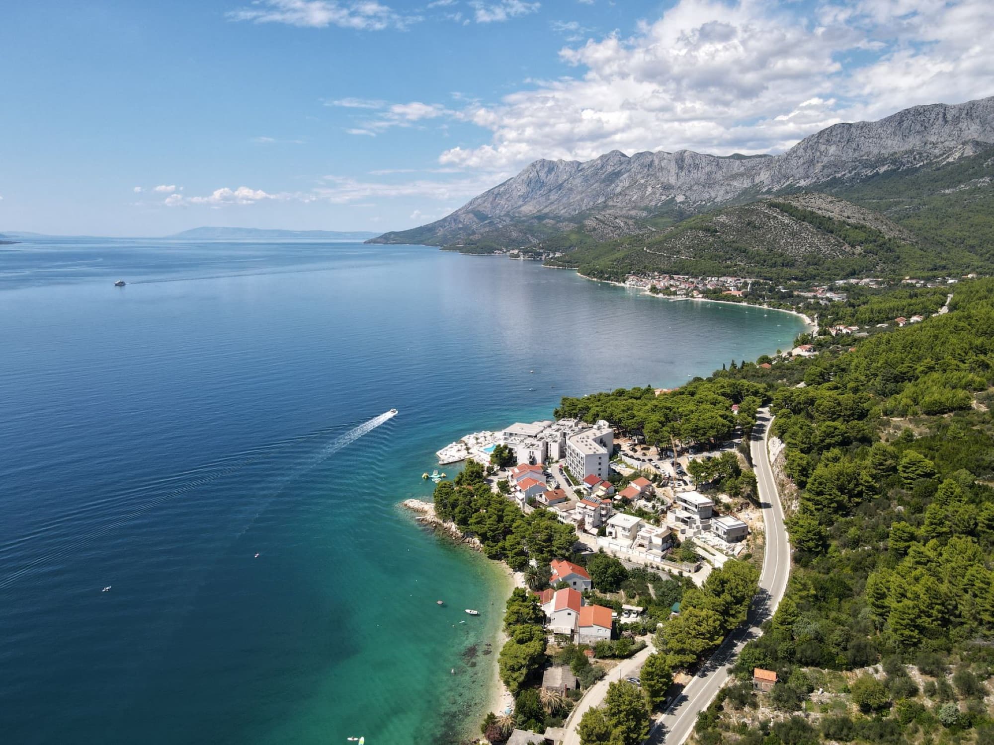 Breathtaking aerial view of Podaca's coastline, featuring turquoise waters and scenic mountains in Croatia.