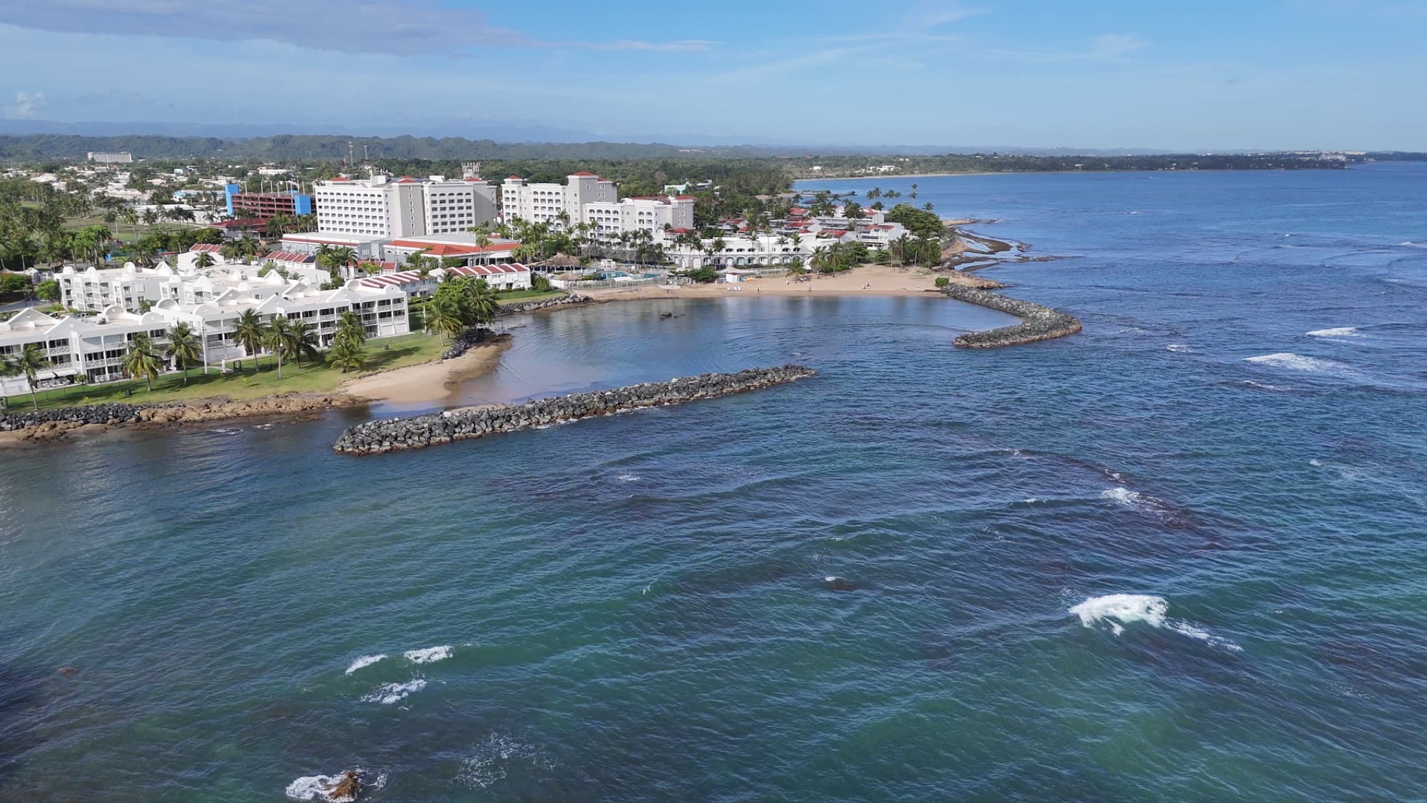 Stunning aerial view of Dorado's beachfront and resorts in Puerto Rico on a sunny day.