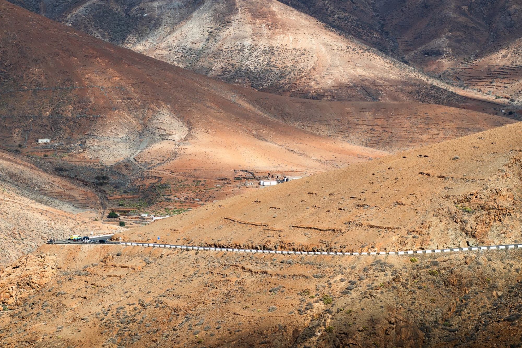 Explore the winding roads of Fuerteventura in the rugged Canary Island landscape, capturing its natural beauty.