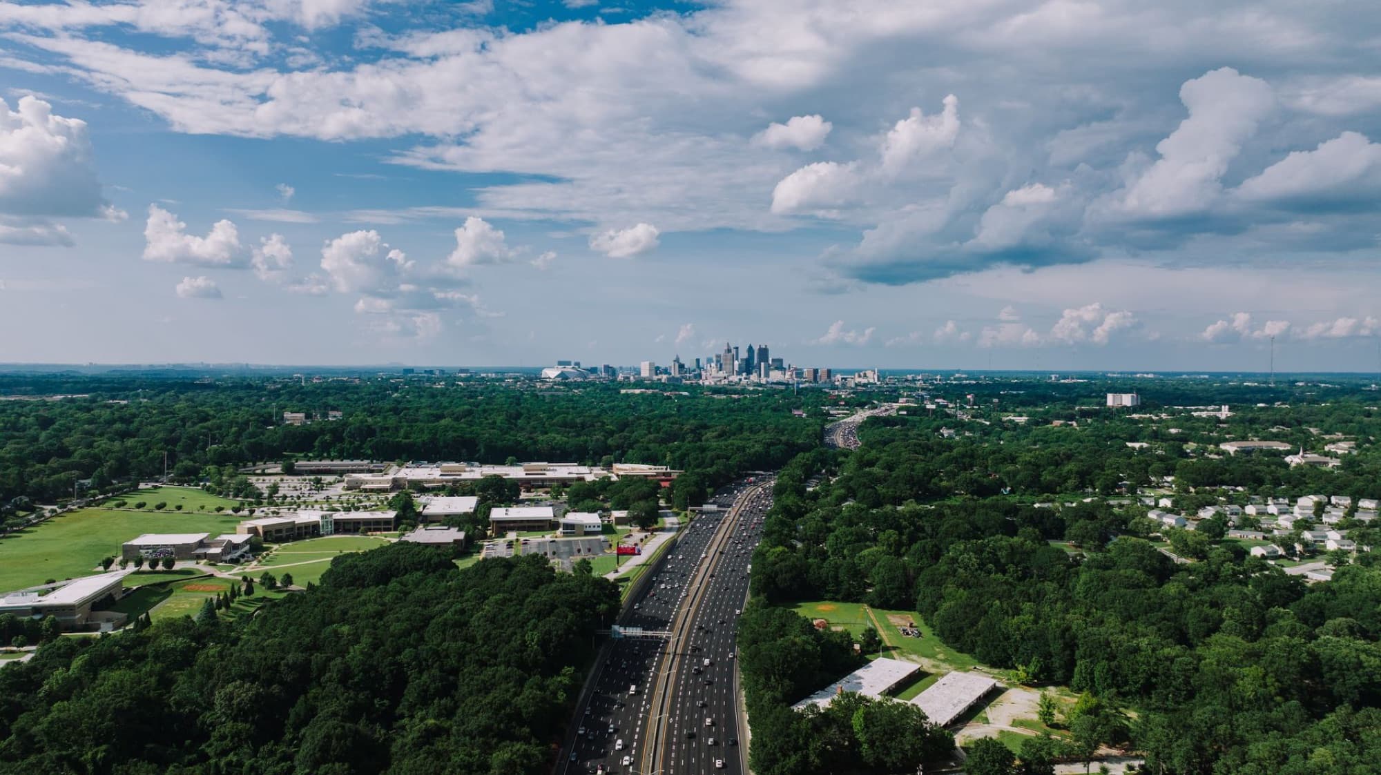 A breathtaking aerial view of Atlanta, Georgia's city skyline and highway.