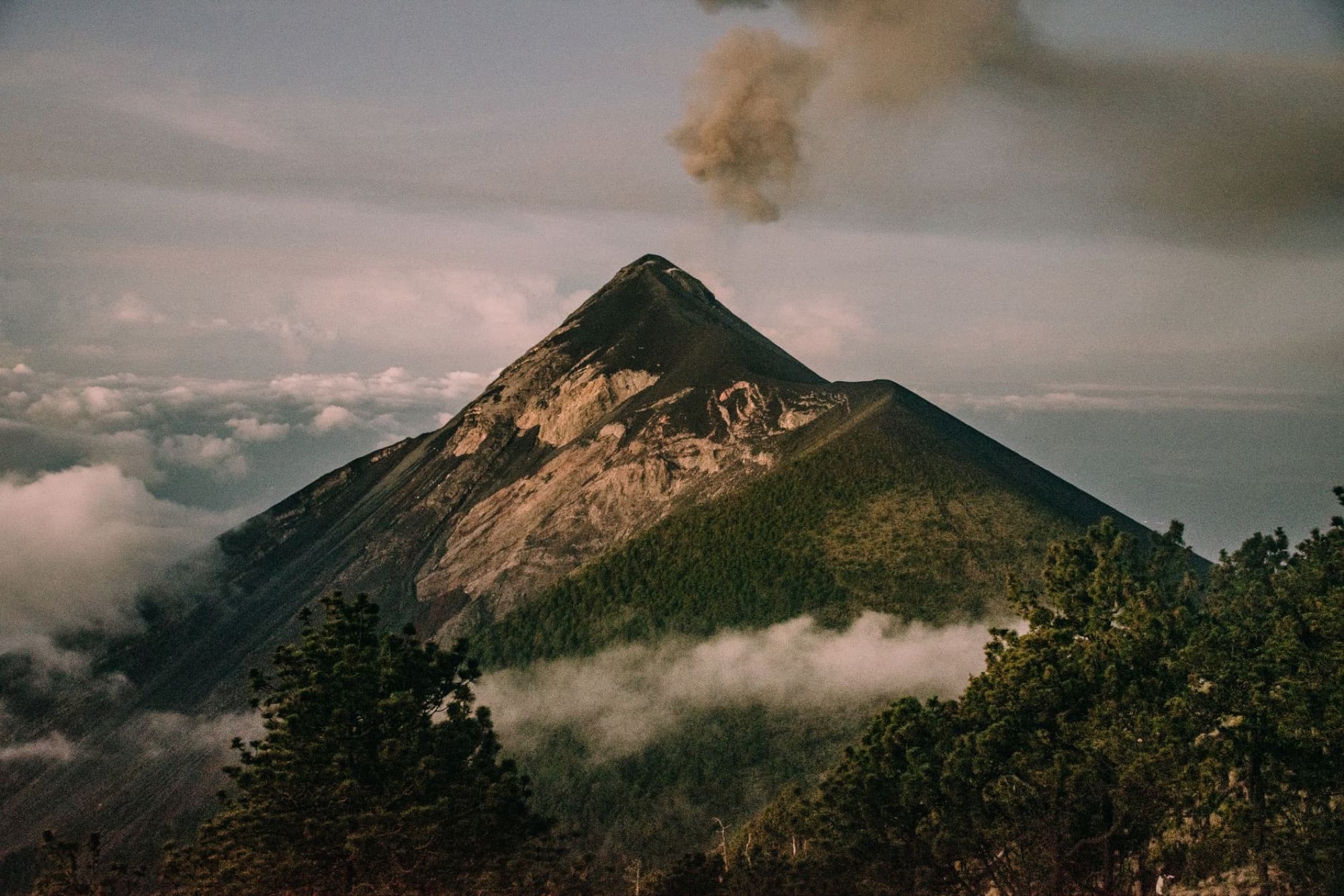 Capture of the erupting Volcán de Fuego in Guatemala with a scenic landscape.