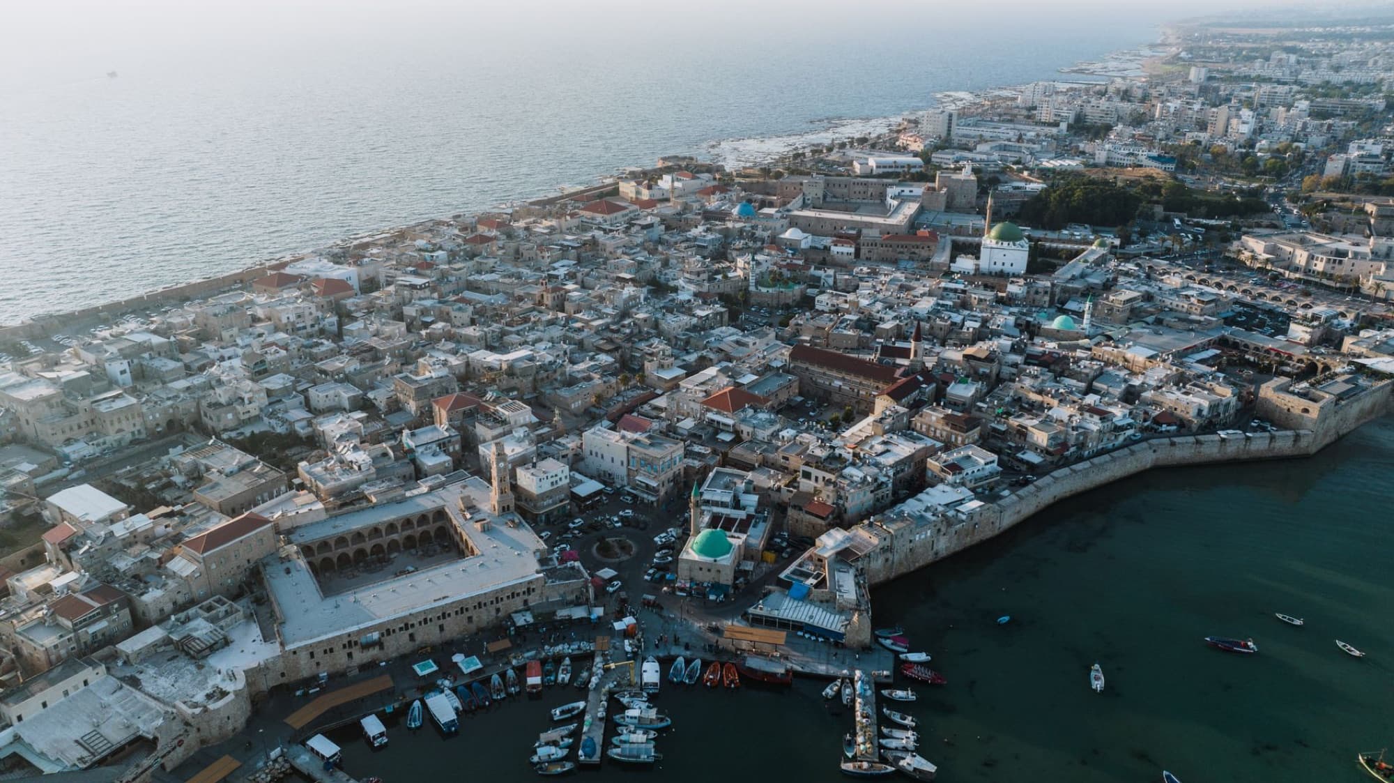 Captivating aerial view of Acre's historic old town and harbor along the Mediterranean coast in Israel.