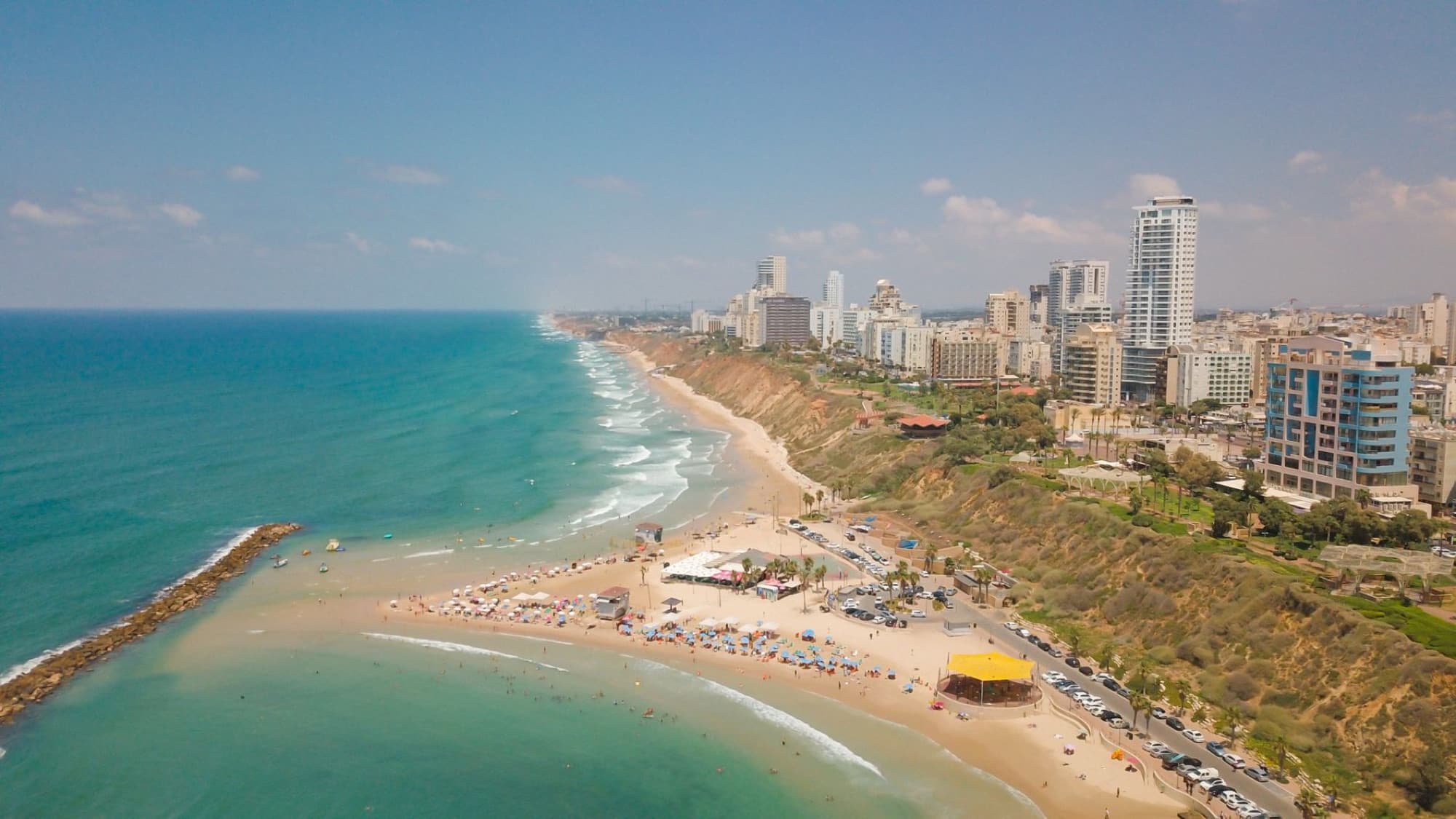 Stunning aerial view of Netanya's coastline, beaches, and modern skyline.