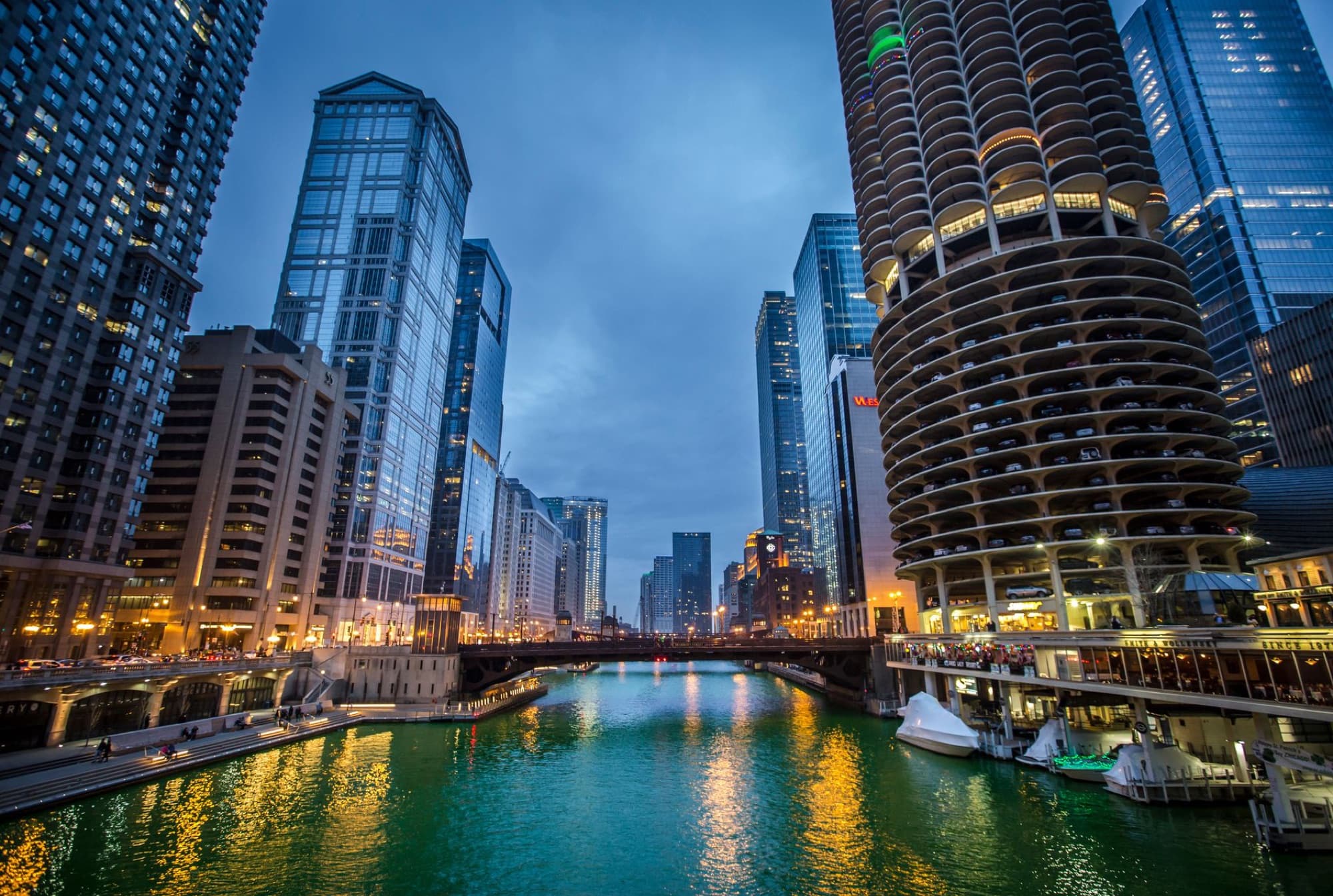 Scenic view of Chicago's downtown skyline over the river at twilight.
