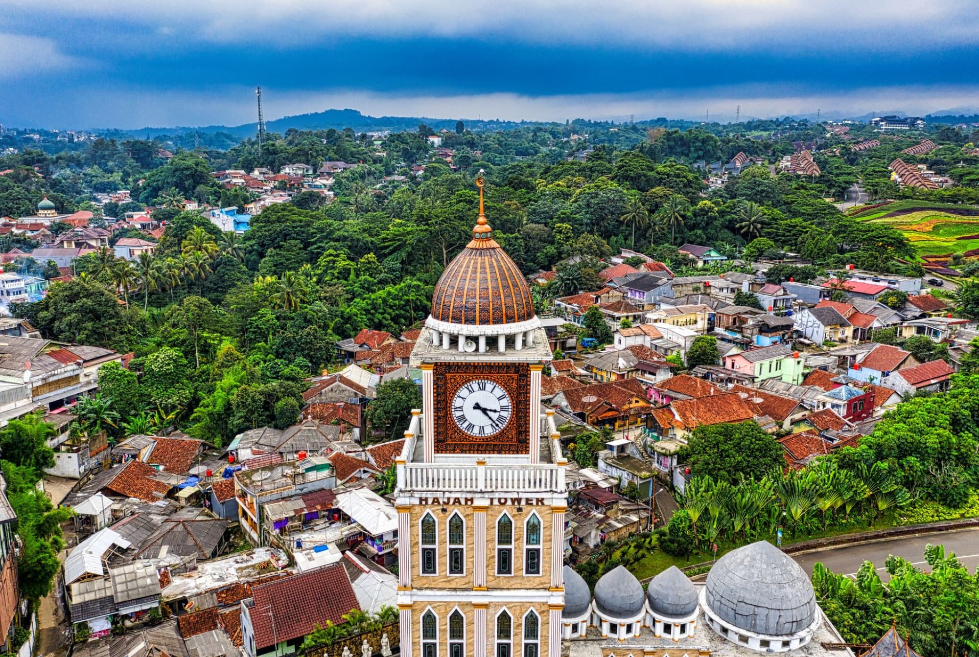 Stunning aerial shot showcasing a clock tower and surrounding urban landscape in Bogor, West Java, Indonesia.