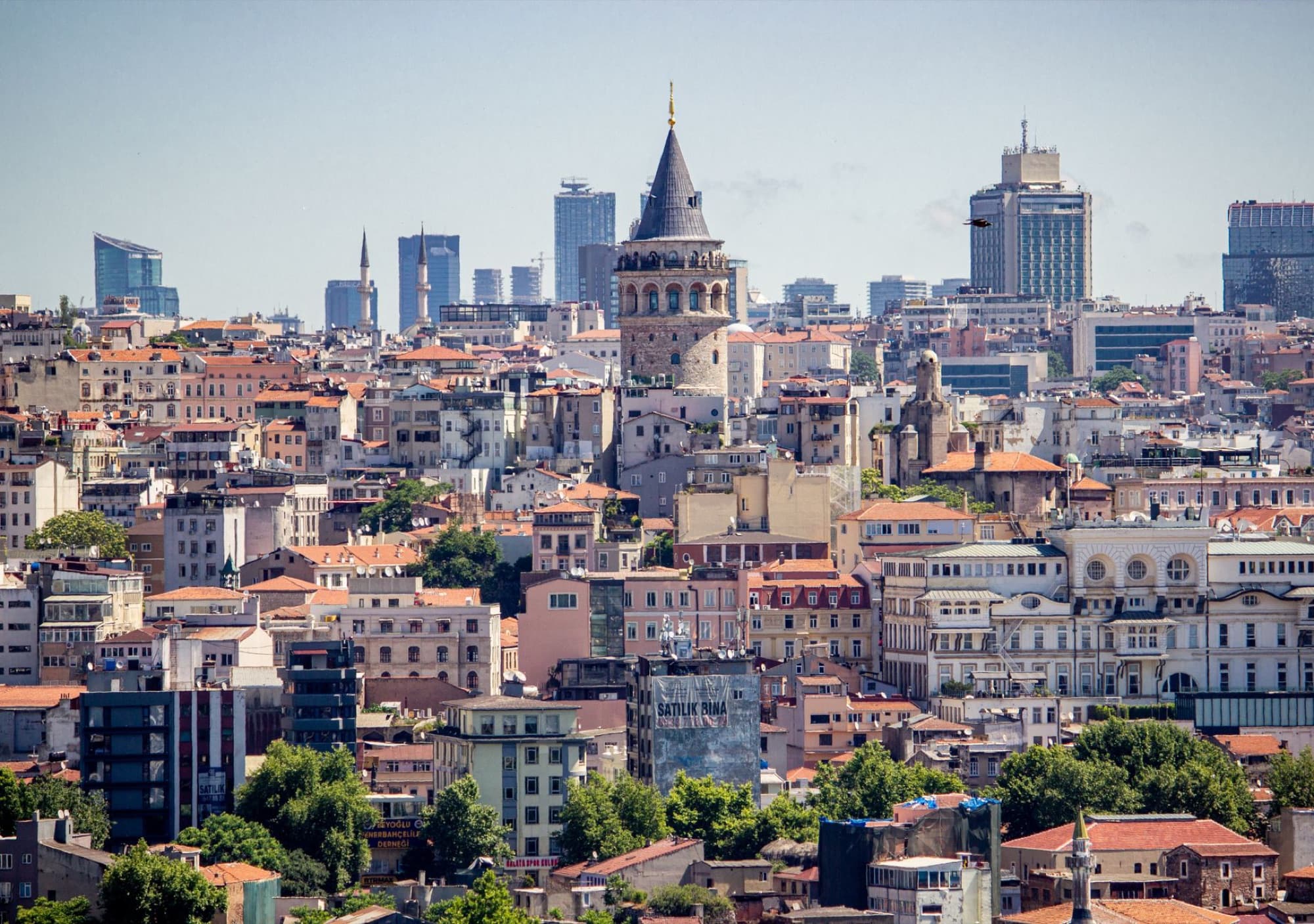 Aerial cityscape of Istanbul showcasing the historic Galata Tower amidst modern skyline.