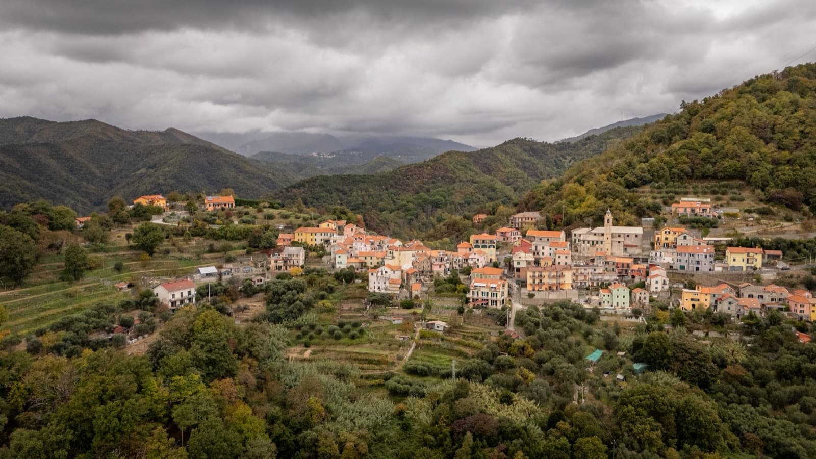 Scenic aerial photograph of Gameragna village nestled in the hills of Liguria, Italy.