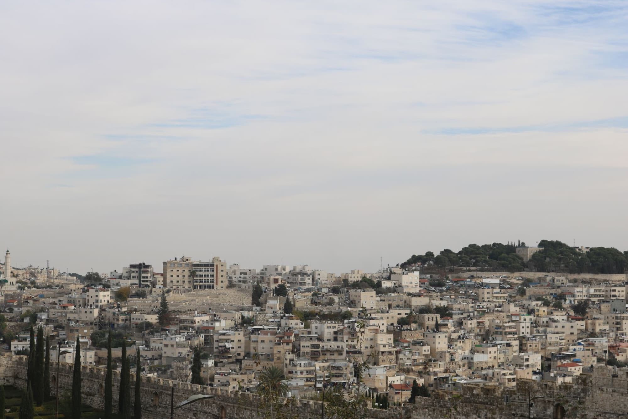 Aerial view of the historical architecture of Jerusalem, showcasing old city buildings and skyline.
