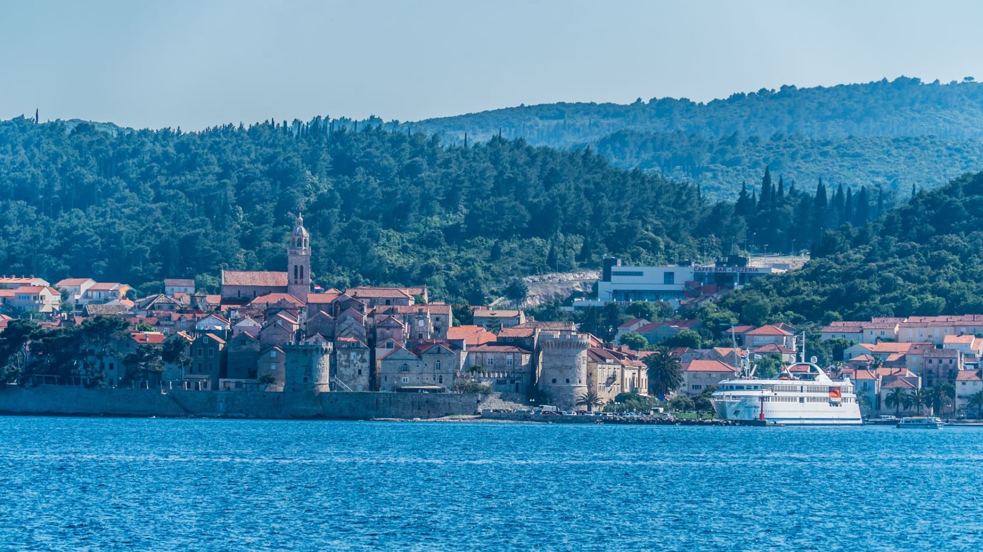 Captivating coastal view of Korčula Island, Croatia, showcasing historic architecture and scenic seascape.