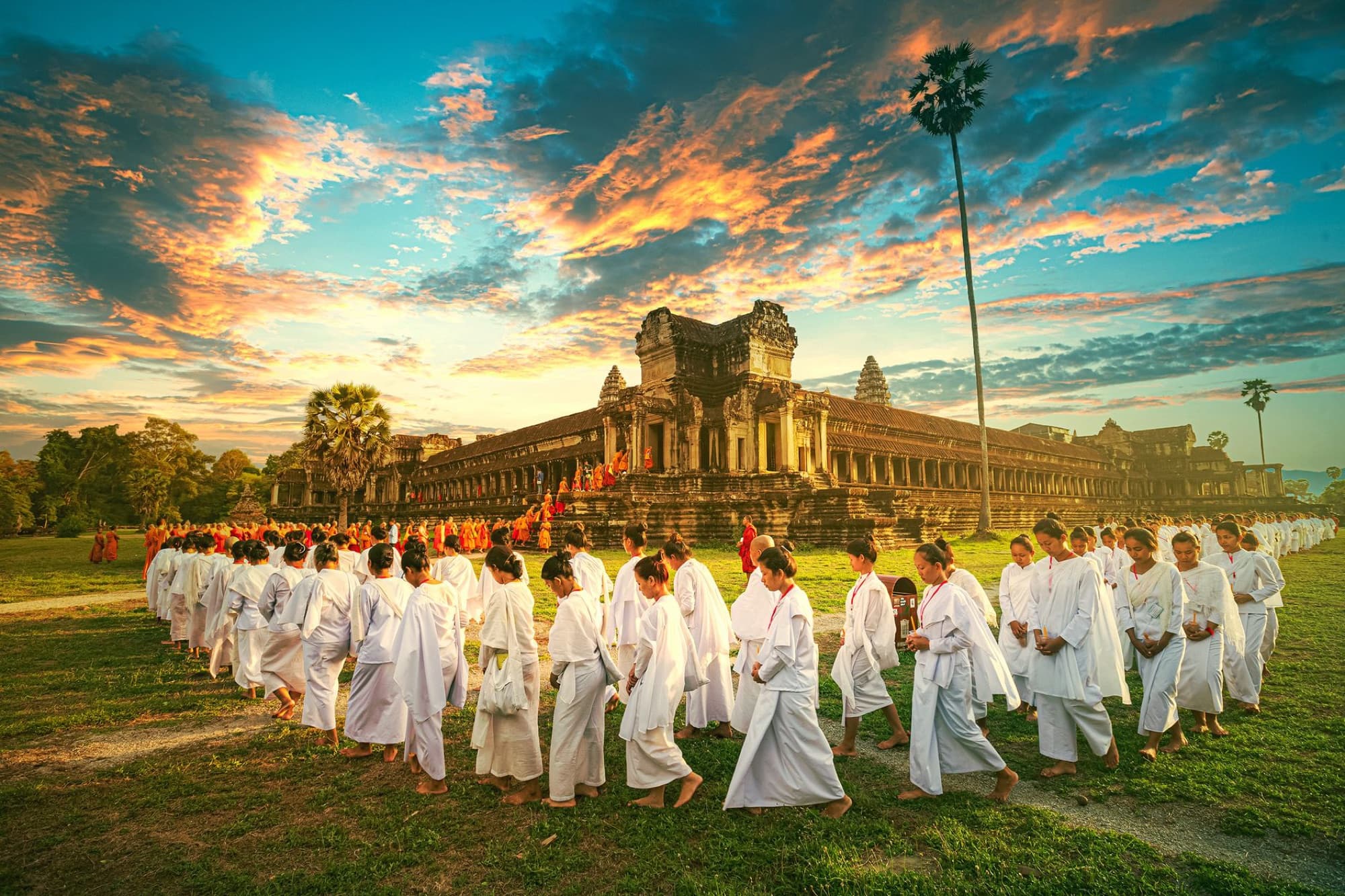 A serene Buddhist ritual ceremony at Angkor Wat in Cambodia during sunset.