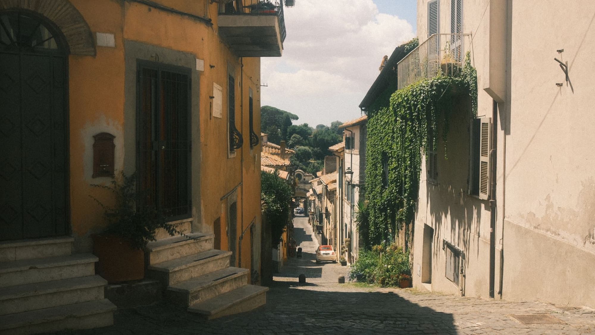 Picturesque alleyway in Anguillara Sabazia, Lazio with warm tones and historic architecture.
