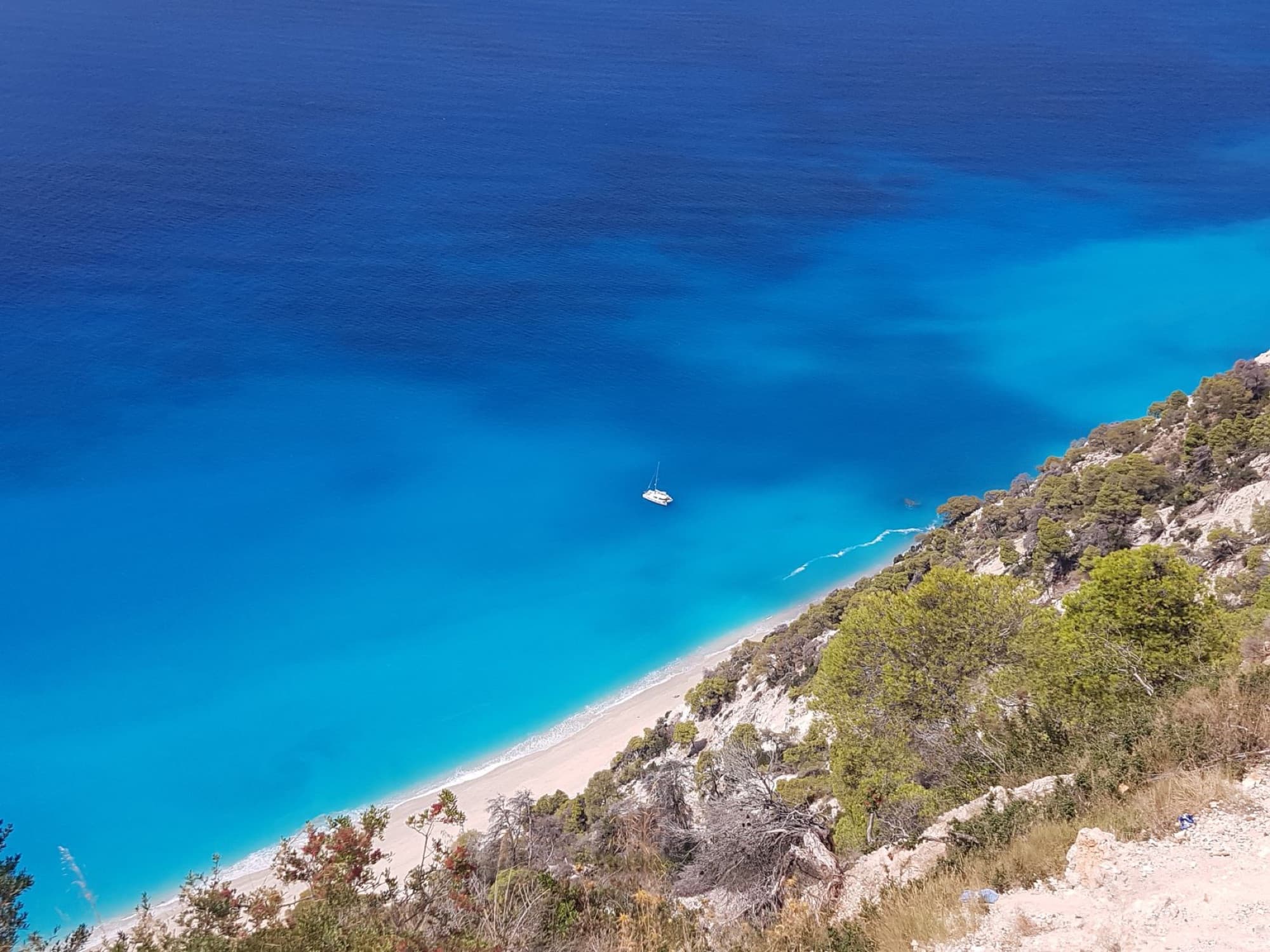 Stunning aerial shot of a tropical beach and turquoise waters in Lefkada, Greece.