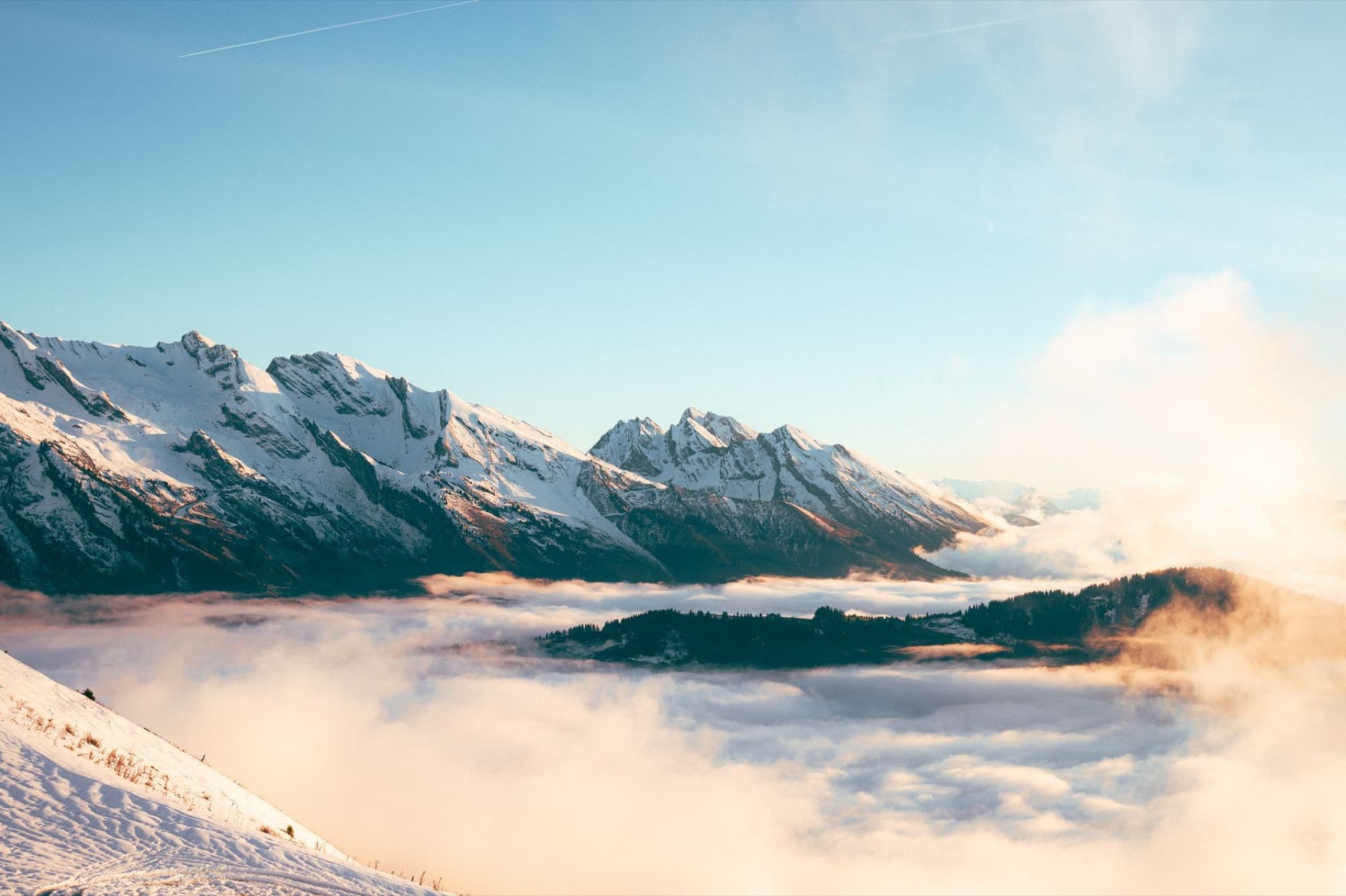 Scenic view of snow-covered mountains during sunrise in Le Grand-Bornand, France.