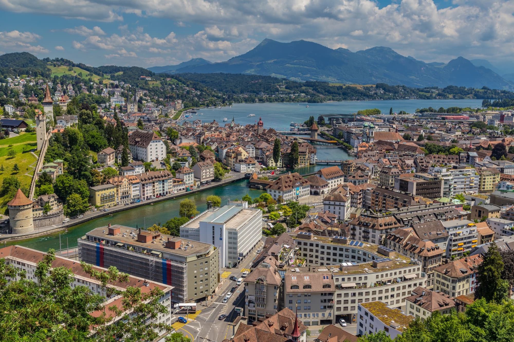 Stunning aerial view of Lucerne, showcasing its unique architecture along the lake and mountains.