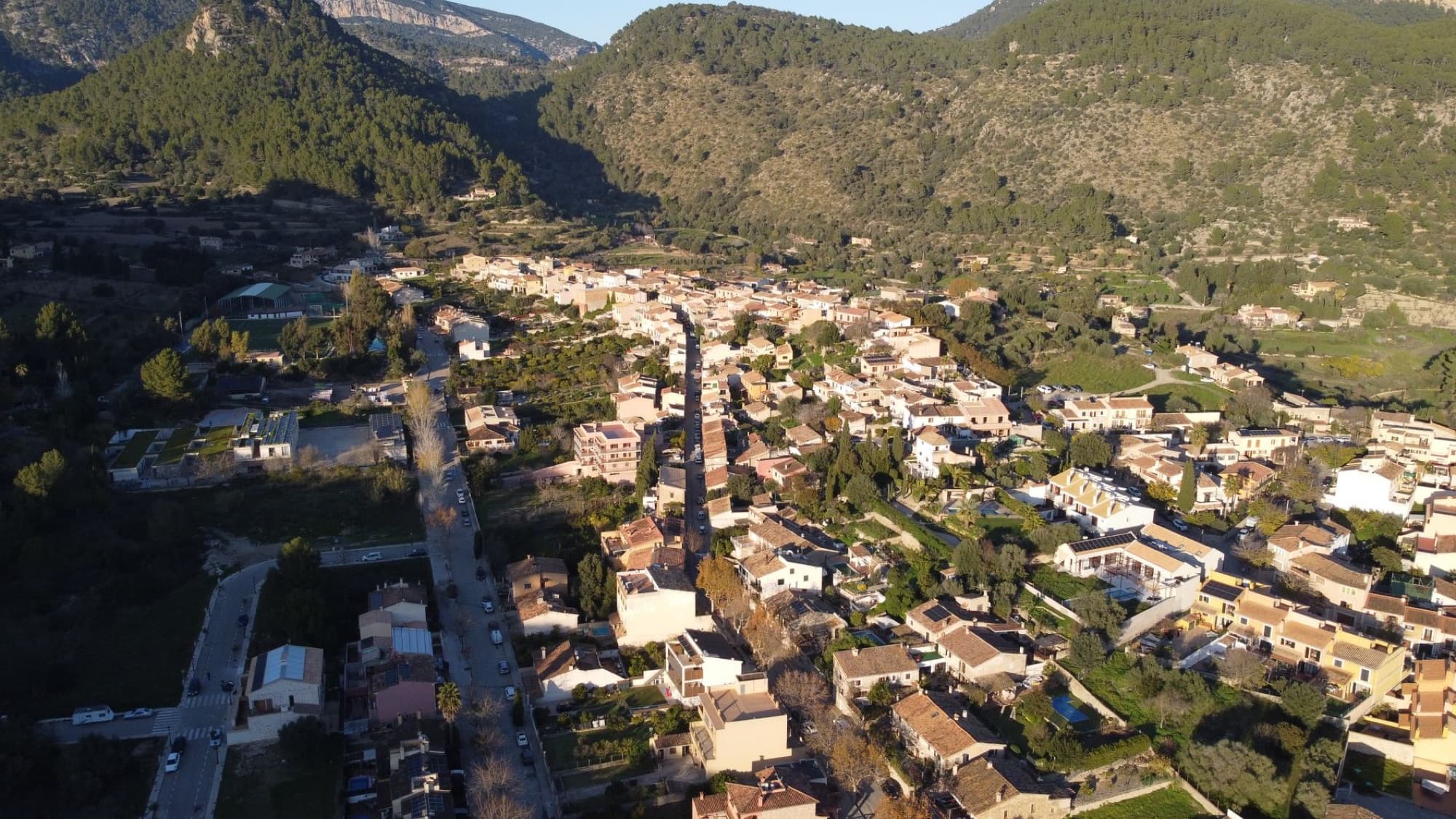 Scenic aerial view of Puigpunyent village nestled in the mountains of Mallorca, Spain.