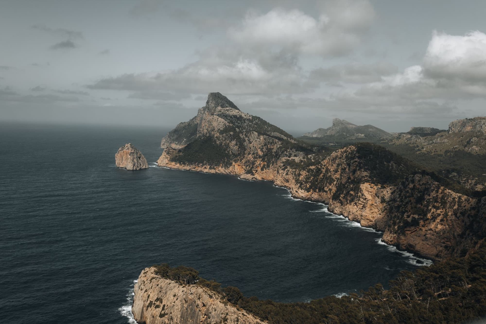 A stunning aerial view of the rugged coastline and cliffs of Cap de Formentor in Mallorca, Spain.